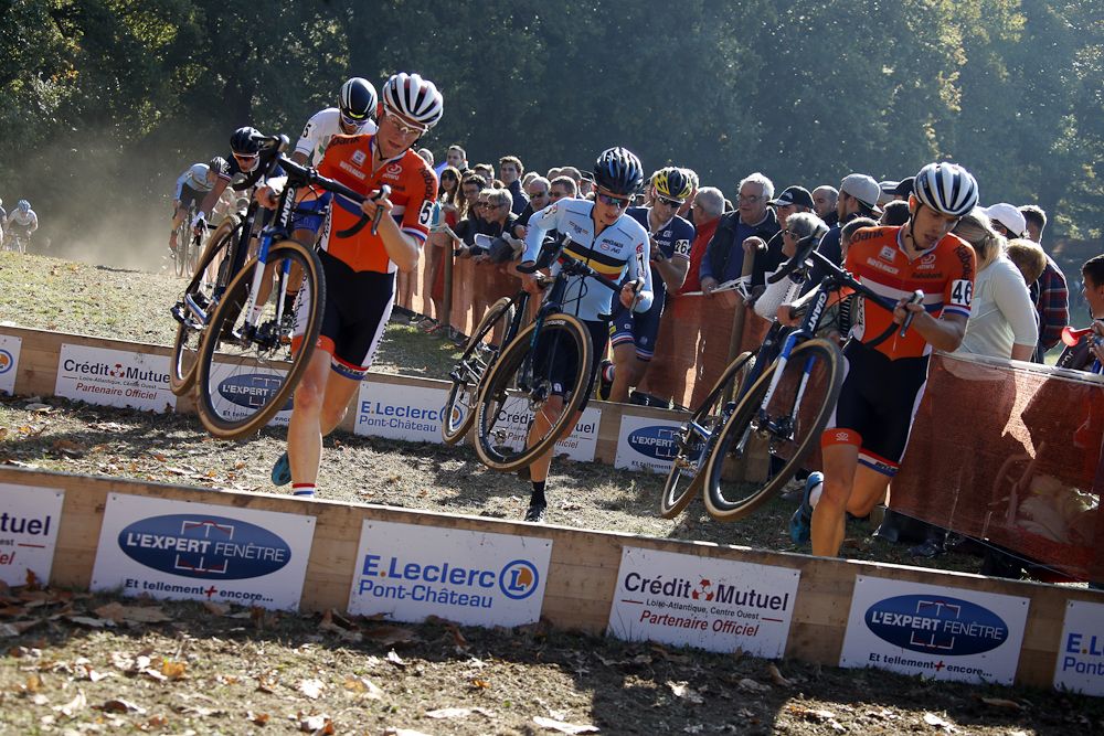 Quintens Hermans of Belgium rides between Dutch riders Joris Nieuwenhuis and Sieben Wouters.