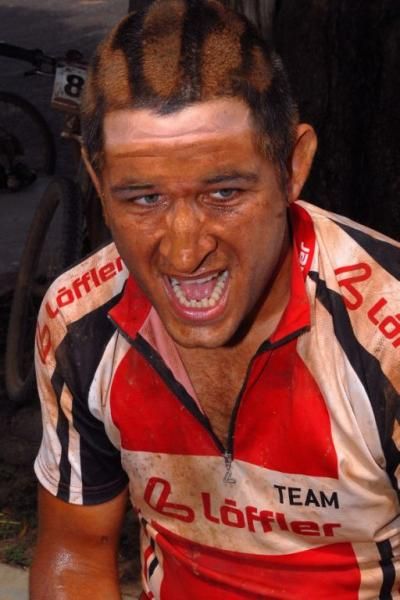 The red sand covers riders after each stage.