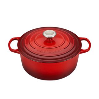 A red cast iron Le Creuset saucepan