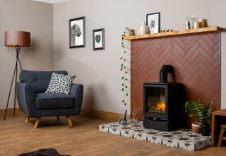 living room with a tiled fireplace