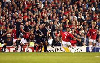 David Beckham strikes a free-kick to score the third goal during the UEFA Champions League Quarter Final, Second Leg match between Manchester United FC v Real Madrid at Old Trafford on April 22, 2003 in Manchester, England.