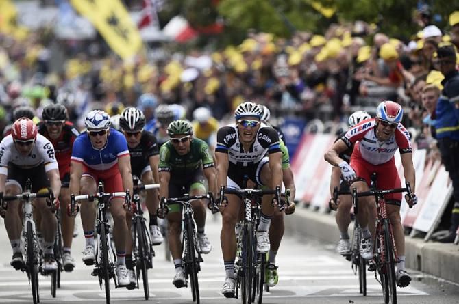 Giant-Shimano's Marcel Kittel throws his bike at the line and takes his third stage win at the Tour de France