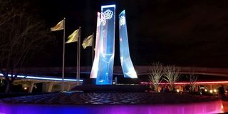 Epcot fountain and flags at night