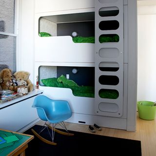 childrens room with bunks beds and teddys