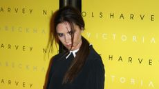 LONDON, UNITED KINGDOM - FEBRUARY 17: Victoria Beckham poses for cameras to toast her collection launch at Harvey Nichols on February 17, 2012 in London, United Kingdom. (Photo by Fred Duval/FilmMagic)