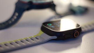 Garmin Instinct 3 next to the Apple Watch Ultra 2