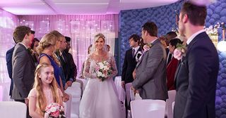 Luke Morgan and Mandy Richardson prepare for their big day as Darren Osborne and guests watch on in Hollyoaks.