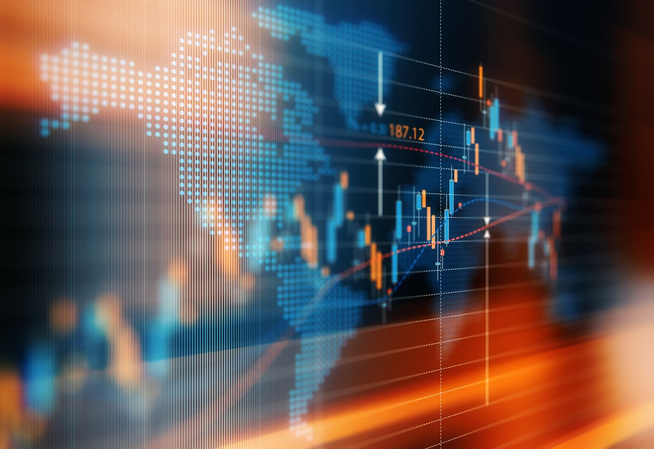 Financial data analysis graph showing global market trends, against world map backdrop