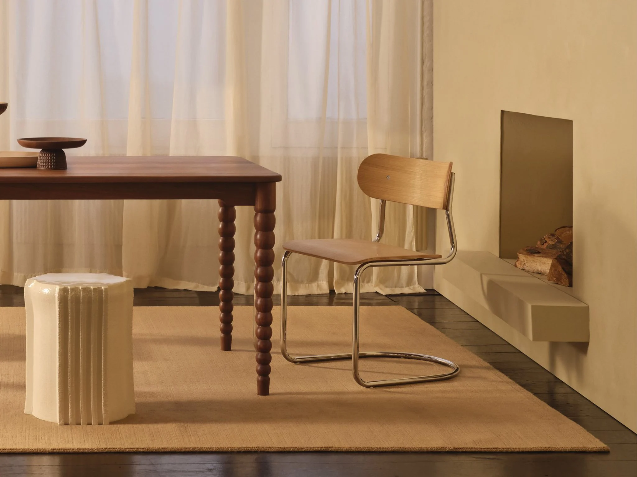 tubular steel chair next to bobbin-leg dining table