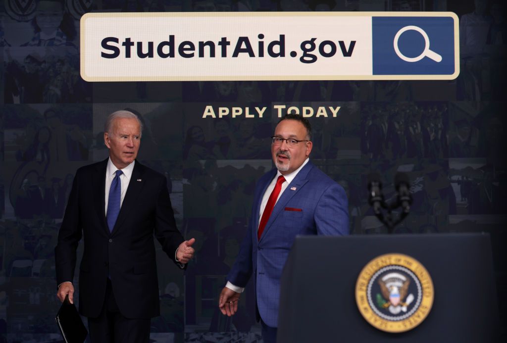 biden and Miguel Cardona photo