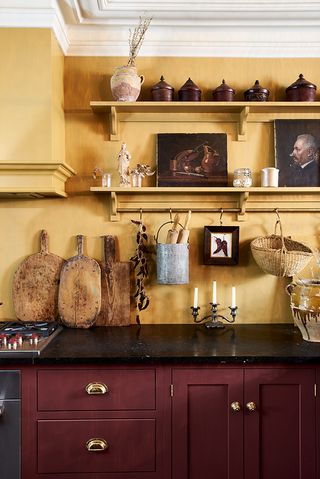 red and yellow kitchen with open shelving