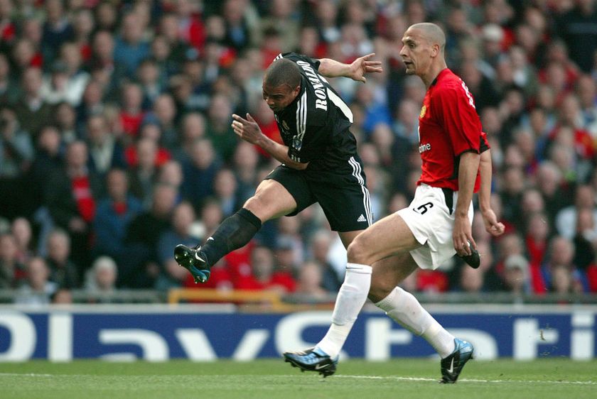 Ronaldo of Real Madrid and Rio Ferdinand of Manchester United challenge during the UEFA Champions League Quarter Final match between Manchester United and Real Madrid at Old Trafford on April 23, 2003 in Manchester, England.