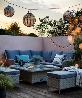 dobbies furniture on decking with sofa and festoon lights