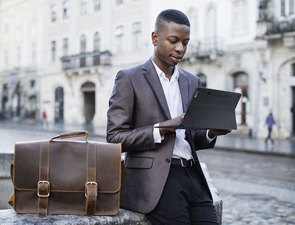 A person using a mobile device in the street.