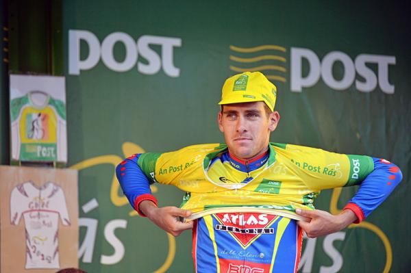 Pirmin Lang (Atlas Jakroo) pulls on the leader's jersey after winning stage 2.