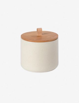 A coffee canister with wooden lid