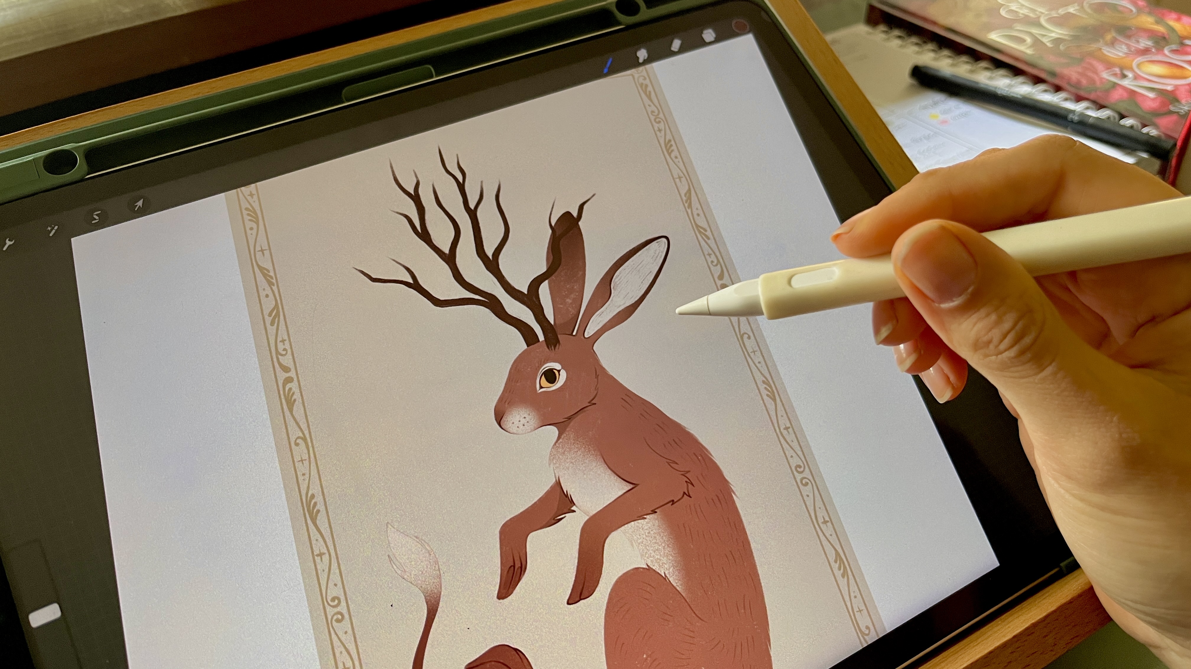 drawing tablets; an artist using a stylus to draw on a screen