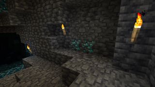 Minecraft diamonds - diamond ore in deep slate with torches