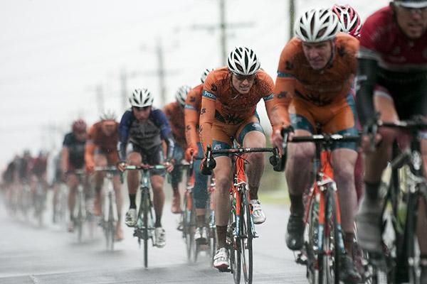 The peloton make their way down the home straight in cold and wet conditions during stage one.