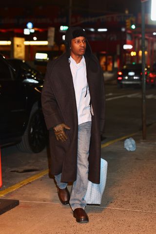 A photo of A$AP Rocky schlepping a baby blue Bottega Veneta woven leather tote bag to the studio in January in New York City.