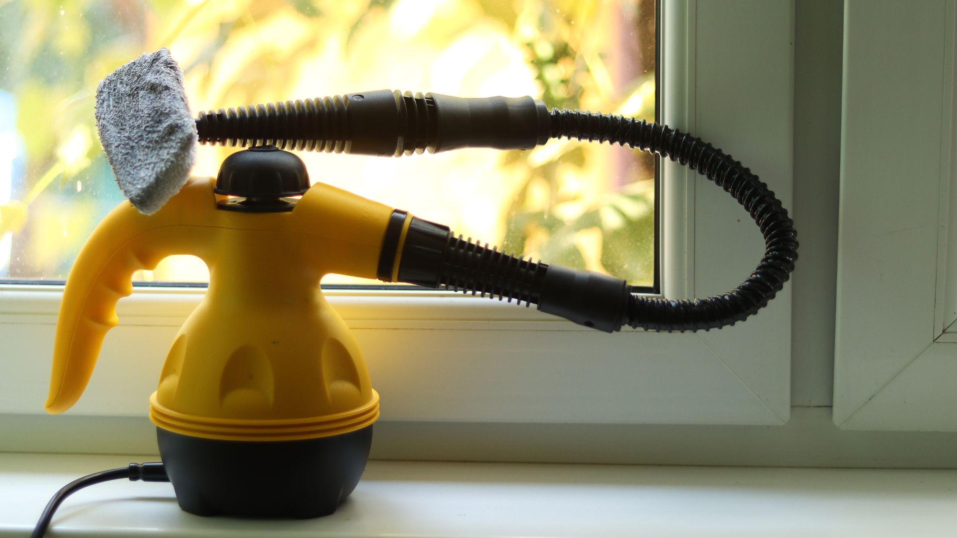 yellow and black steam cleaner