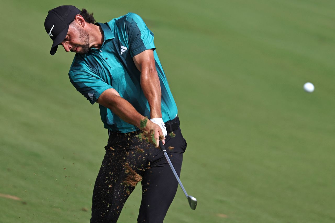 Marco Penge hits an iron shot