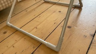 Dunelm Heated Airer With Wings feet from an angle