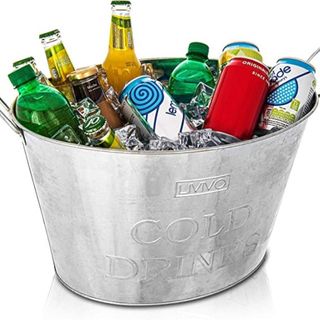 Silver cooler bucket with ice and drinks inside