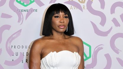 Venus williams pictured with a bob with bangs hairstyle in a white dress