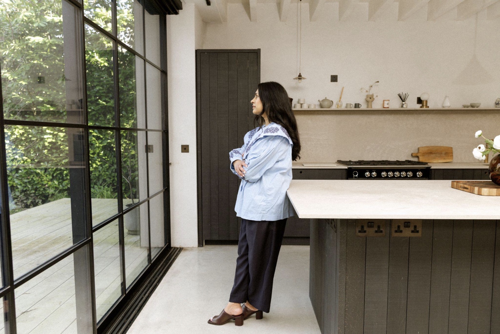 designer stood in kitchen