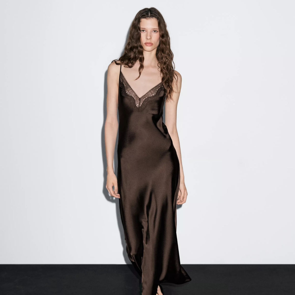 Model in a brown satin dress