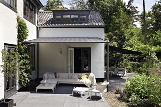 awning over seating outdoors from luxaflex