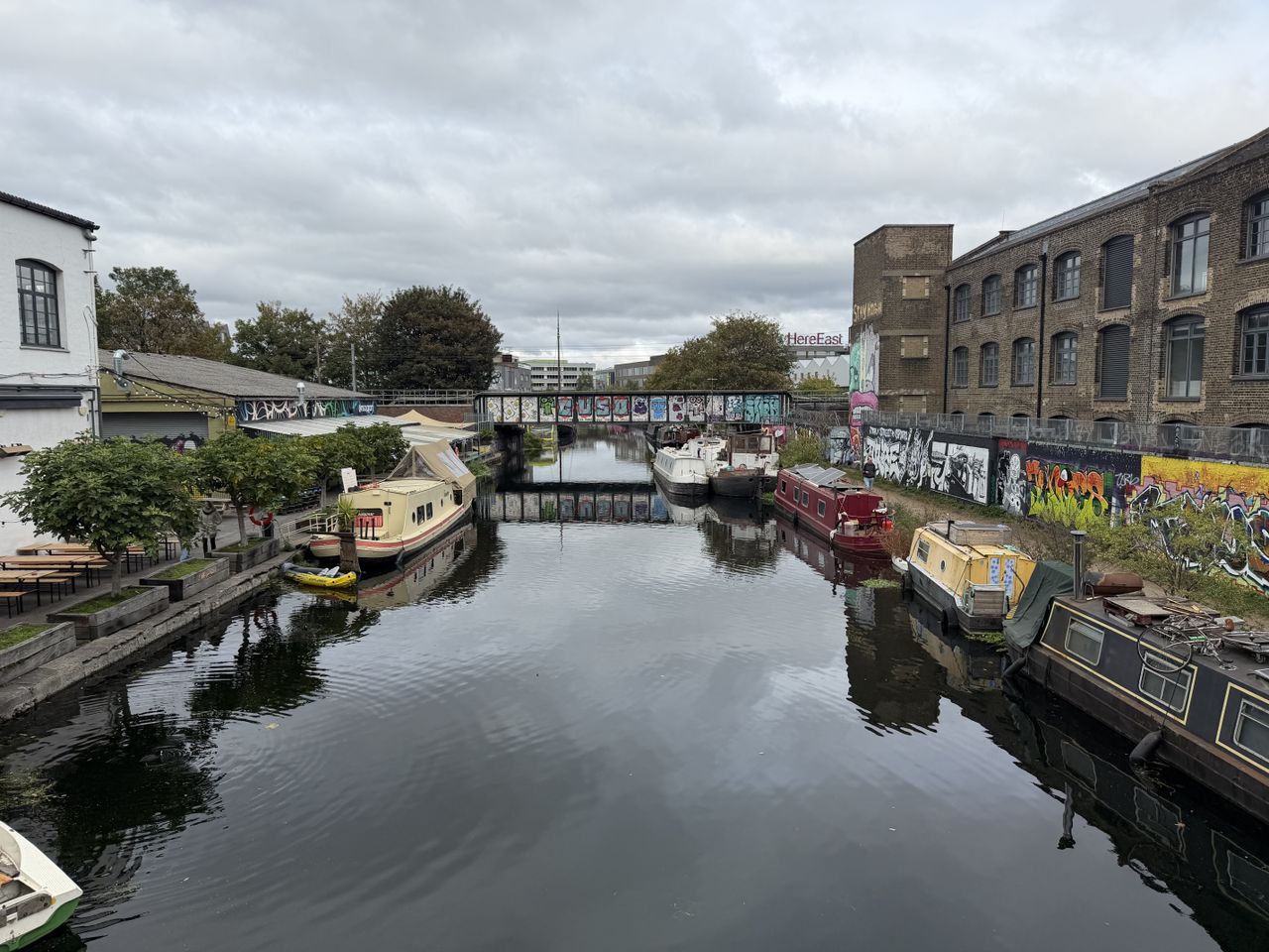 Sample photo from iPhone 17 Pro showing boats moored on river under bridge