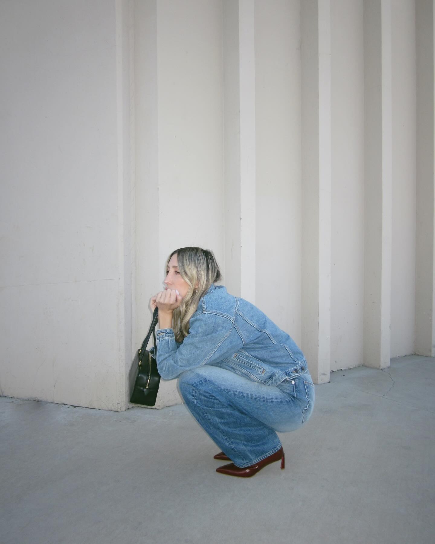Influencer wearing straight-leg jeans and low-heel ankle boots