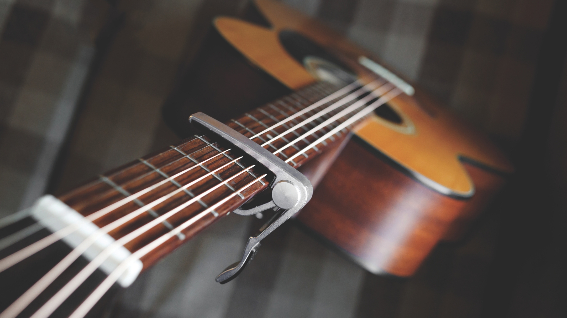 A guitar capo on an acoustic guitar