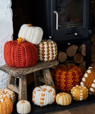 A set of crochet pumpkins by Hobbycraft in orange, cream, mustard yellow and Houndstooth pattern