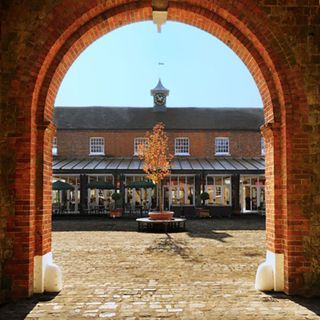 arched roof with brick wall and brick path