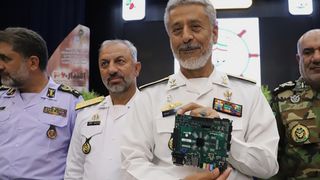Iran's Rear Admiral Habibollah Sayyari holding the Zedboard "quantum processor"