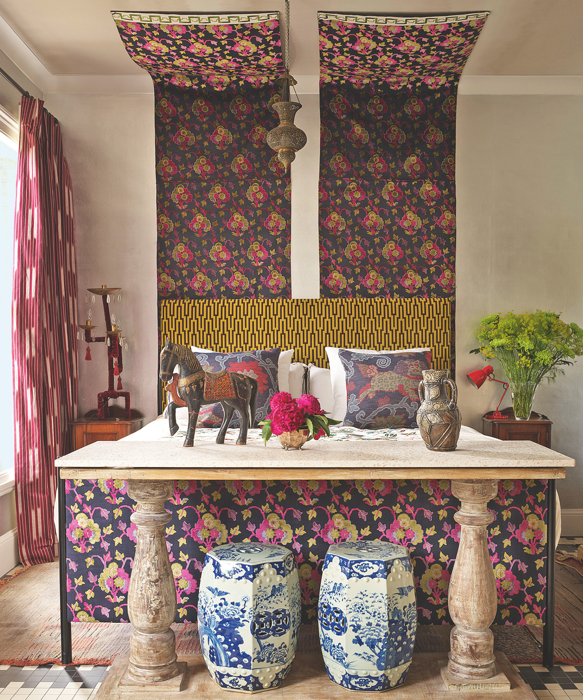 Purple fabric over a bed in a dramatic bold bedroom