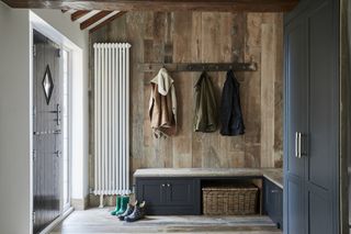 bootroom/mudroom with reclaimed wood, bench storage and coat rack