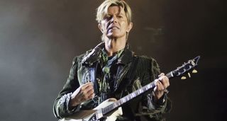 David Bowie plays a Supro onstage in 2004.