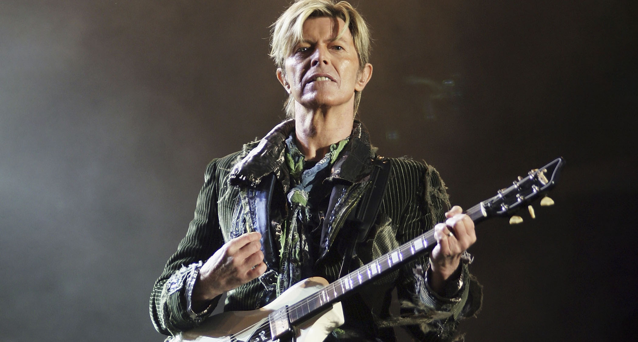 David Bowie plays a Supro onstage in 2004.