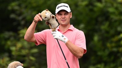 Martin Kaymer pulls the headcover off his driver