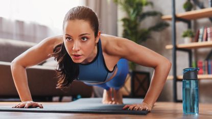 Woman doing plank at home