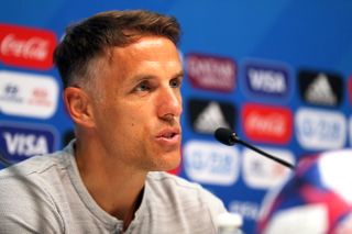 Phil Neville has said that a member of American staff visiting the England team hotel is