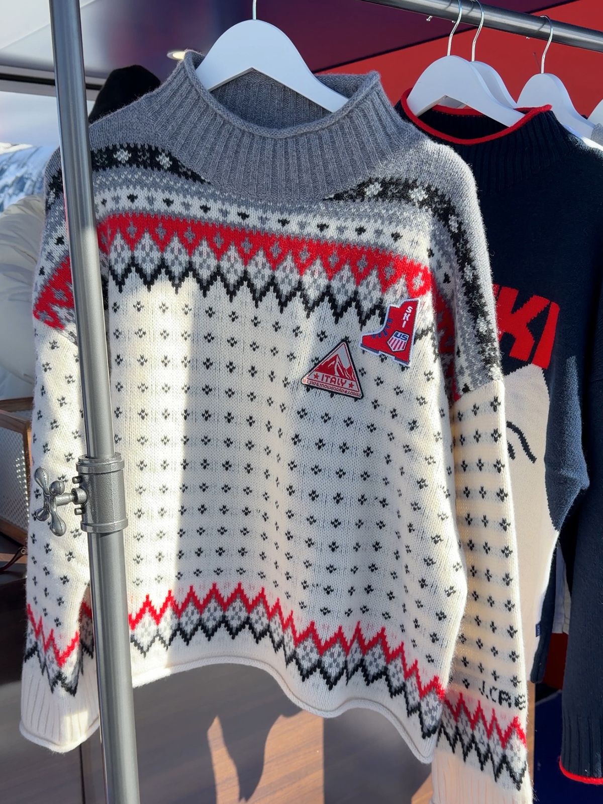 A photo of the viral Fair-Isle sweater at J.Crew's pop-up in Aspen celebrating the U.S. Ski &amp; Snowboard partnership.