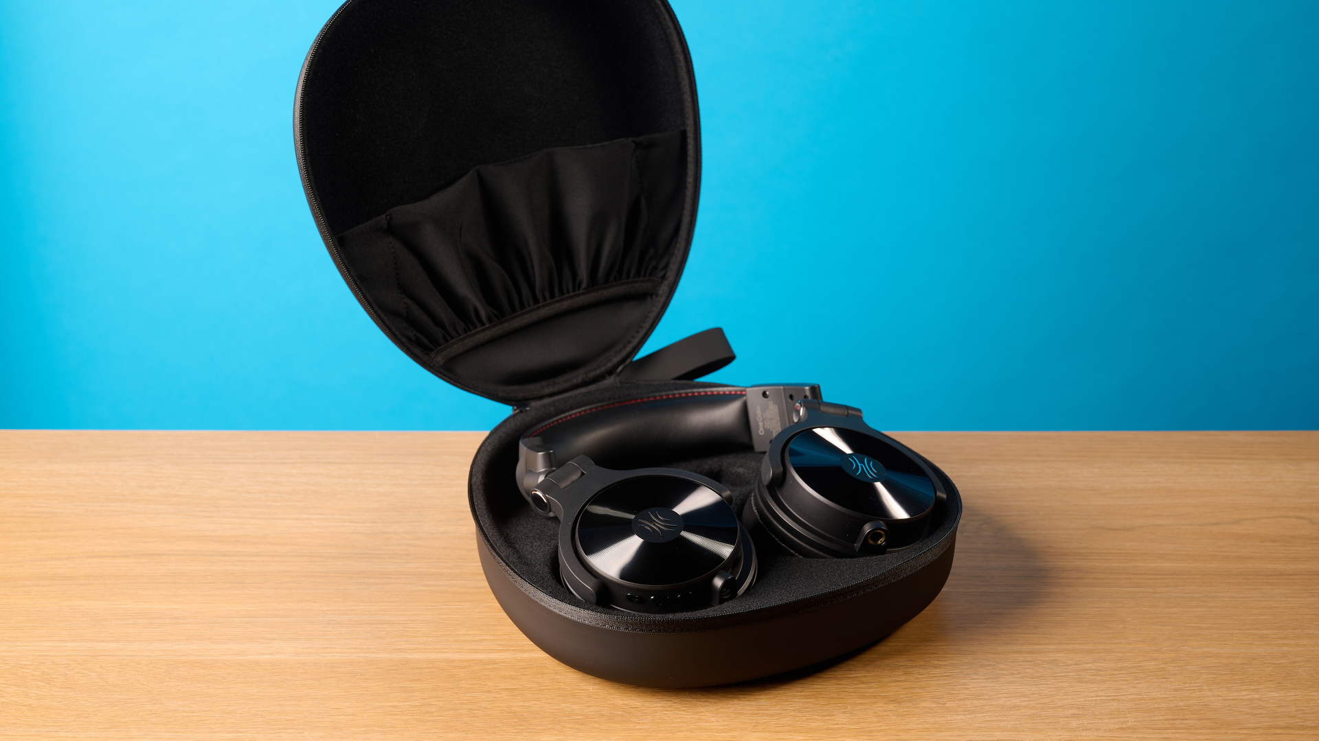 OneOdio Studio Max 2 in black photographed in front of a blue background