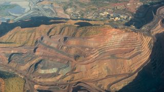 Aerial view of the Argyle diamond mine with exposed earth and infrastructure.