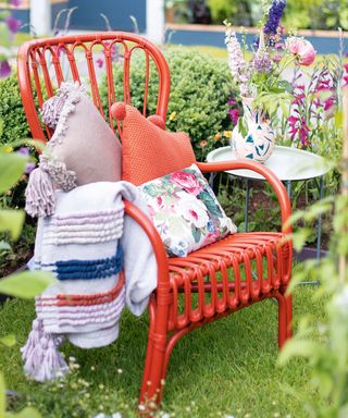 garden area with chair and patterned cushions
