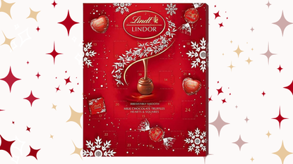 the red lindt advent calendar on a background of red stars